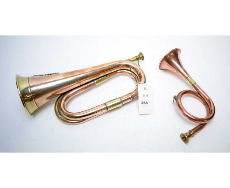 A copper and brass Royal Welsh Fusiliers bugle; together with a smaller copper and brass hunting horn. (2)