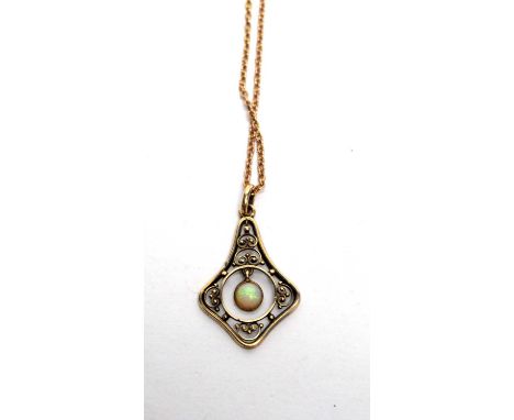 An Edwardian opal and 14ct yellow gold pendant, on 9ct yellow gold cable link chain, 5.3g gross. 