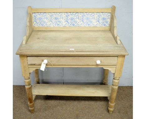 A Victorian tile-back washstand, with gallery back above single drawer, shelf below, 89 × 46 × 97cms high.