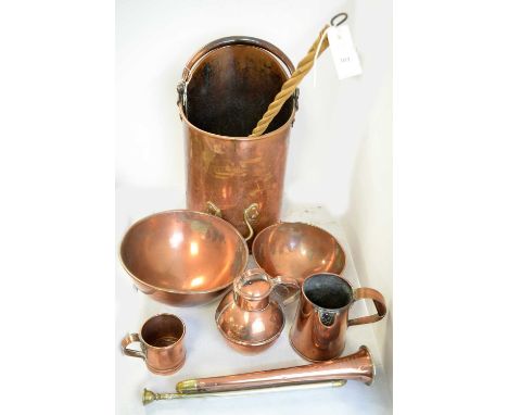 A selection of copper wares, including: copper coal skuttle; copper circular bowls; copper and brass hunting horn by Butler H