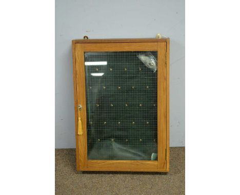 Remploy Limited: A mid century light oak glazed wall key/display cabinet , 52 x 11 x 73 cms high