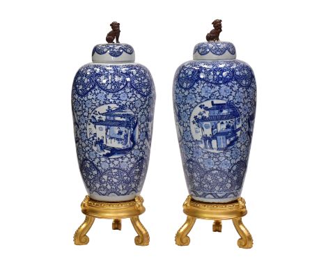 A RARE PAIR OF CHINESE BLUE AND WHITE PORCELAIN ‘SOLDIER' VASES AND COVERS, QING DYNASTY, KANGXI PERIOD, 1662 – 1722Boldly pa