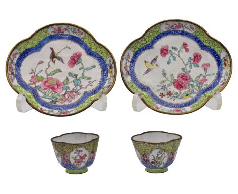 A PAIR OF CANTON ENAMEL QUATRELOBED CUPS AND SAUCERS, QING DYNASTY, QIANLONG PERIOD, CIRCA 1750Each piece painted with quatre