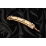 A RARE CHINESE JADE SILVER & GOLD INLAID BRONZE ‘MASK’ BELT-HOOK, WARRING STATES PERIOD, 475–221 BC