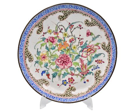 A CANTON ENAMEL SAUCER DISH, QING DYNASTY, QIANLONG PERIOD, 1736 – 1795Finely painted an arrangement of peonies, day lilies, 