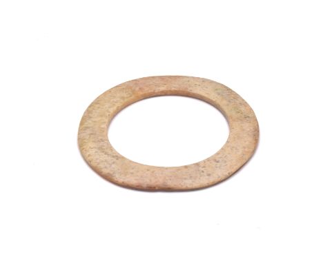 A CHINESE JADE RING, HUAN, NEOLITHIC PERIOD, 10,000 – 2,200 BCOf slightly irregular circular shape, pierced to the centre wit