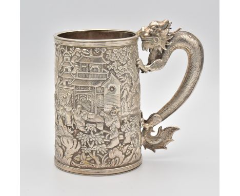 A CHINESE EXPORT SILVER ‘DRAGON’ TANKARD, QING DYNASTY, 19TH CENTURYChased with a repousse Chinese landscape scene around a c