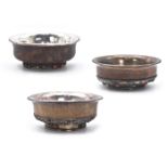 THREE TIBETAN SILVER AND BURLWOOD TEA BOWLS, 19TH CENTURY