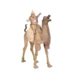 A LARGE CHINESE UNGLAZED GREY POTTERY CAMEL WITH DETACHABLE RIDER, TANG DYNASTY, 618 – 907 AD