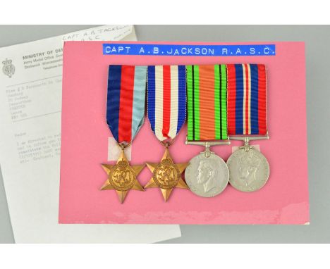 A WWII GROUP OF MEDALS, mounted on card, all named to P/125199 Captain A.B. Jackson, Royal Army Service Corps (RASC), to incl