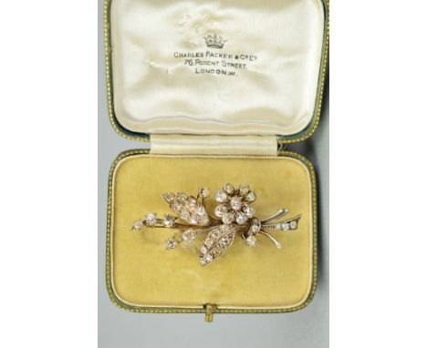 AN OLD EUROPEAN FLORAL AND FOLIATE DESIGN DIAMOND SPRAY BROOCH, measuring approximately 57mm in length x 29.4mm, estimated to