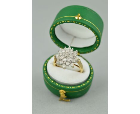 A 9CT GOLD DIAMOND CLUSTER RING, designed as a tiered cluster of brilliant cut diamonds, estimated total diamond weight 0.75c