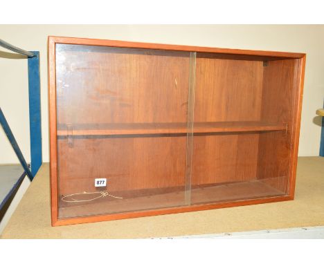 A SMALL TEAK BOOKCASE with one shelf and two glass sliding doors, circa 1970, approximate height 50cm x length 80cm x width 2