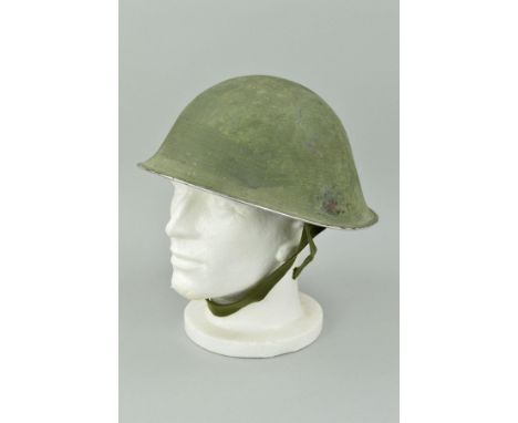 A BRITISH ARMY ISSUE MKIV CIRCA 1950-60 HELMET, with liner, strap etc