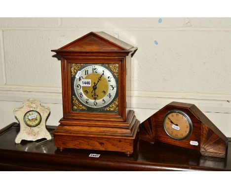 AN EARLY 20TH CENTURY OAK BRACKET CLOCK, with silvered Arabic numerals, together with an oak mantel clock and a ceramic clock