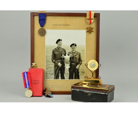 A MONEY TIN CONTAINING THE FOLLOWING MEDALS, etc, 1939-45, Africa Star (1st Army bar) War medal, un-named, Staffordshire Regi