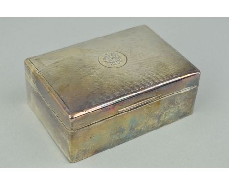 A GEORGE V SILVER CIGARETTE CASE OF RECTANGULAR FORM, engine turned cover with monogram to centre, London 1926, width 13.5cm 