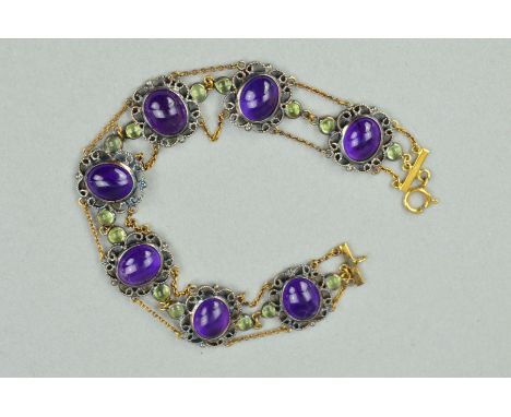A GEM BRACELET, designed as an oval amethyst cabochons within scrolling rope twist surrounds flanked by green gem circular ca