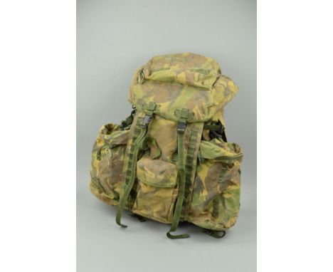 A CURRENT BRITISH ARMY ISSUE 'BERGEN' BACK PACK, in regulation camo, all complete and marked in ink to a soldier with Grenadi