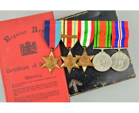 A LARGE MILITARY TIN, with arrow mark, containing a swing mounted WWII group of medal to a soldier who was fortunate enough t