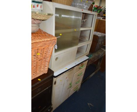 AN ENAMEL TOPPED KITCHEN CABINET flanked by four drawers and a seperate similar glass front cabinet (2)