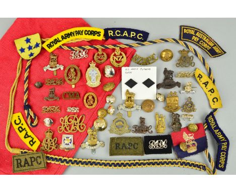 A RED CANVAS BANK CASH BAG, containing a large number of badges, patches, shoulder devices, buttons, etc, all with Royal Army