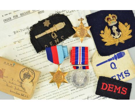 A WWII GROUP OF THREE MEDALS AND PATCHES, attributed to D.J. Baldwin, Merchant Navy, 1939-45, Atlantic Stars and War medal (u
