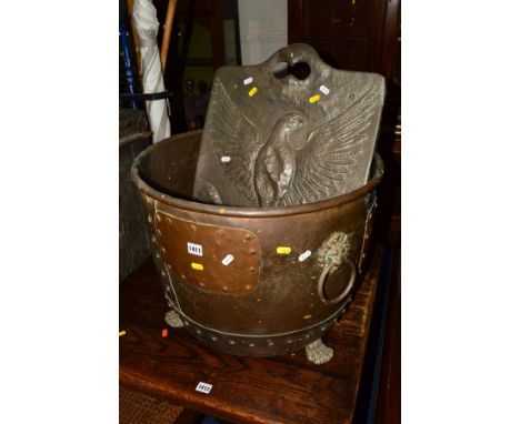 AN EARLY 20TH CENTURY RIVETED COPPER, on claw feet and a copper fire screen (2)