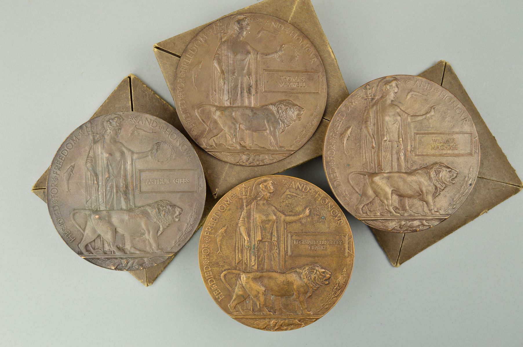 FOUR WWI MEMORIAL DEATH PLAQUES, three of which are contained in ...