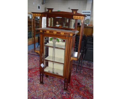 AN EARLY 20TH CENTURY MAHOGANY AND INLAID ARTS &amp; CRAFTS DISPLAY CABINET, rectangular top above an arched bevel edged mirr