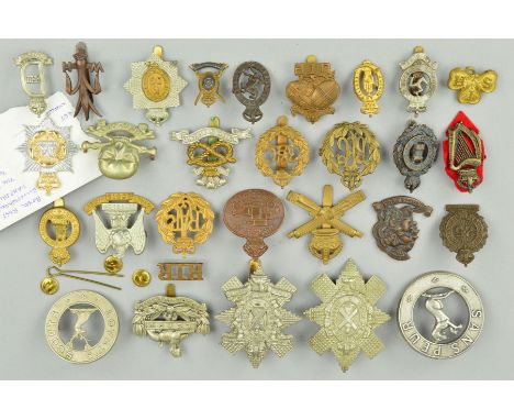A PLASTIC ENVELOPE CONTAINING TWENTY EIGHT WWI ERA CAP BADGES AND DEVICES, all believed original including rarely seen Regime