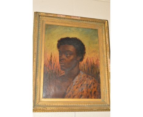A HEAD AND SHOULDER PORTRAIT OF A YOUNG BLACK AFRICAN MAN, the fur of a Leopard is draped over one shoulder, unsigned, framed