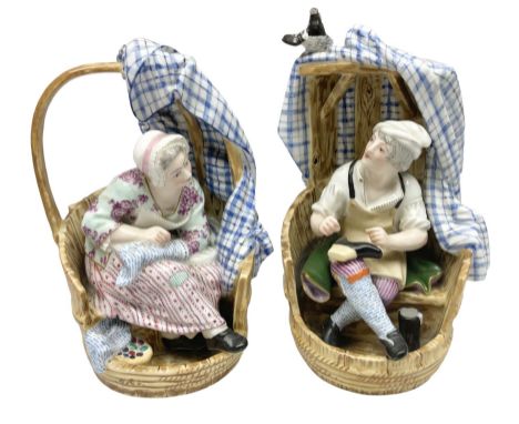 Pair of Continental figures in the Meissen style, modelled as a shoemaker and a laundress seated within wooden barrels with g