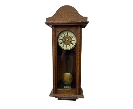 German - early 20th century 8-day spring driven oak cased wall clock, with a two-part dial with a gilt centre and enamel chap