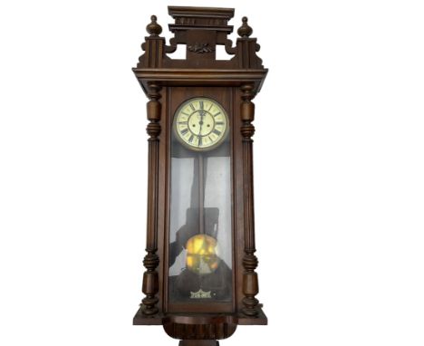 German - late19th century 8-day weight driven Vienna regulator, in a glazed case with a raised pediment and finials, two-part