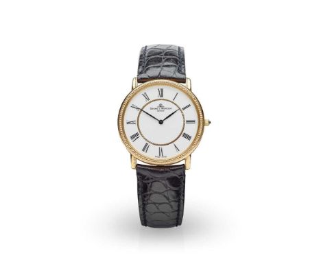 model number 15607, quartz movement, round white dial with Roman numerals in black, inner gold circle to centre of dial, bead