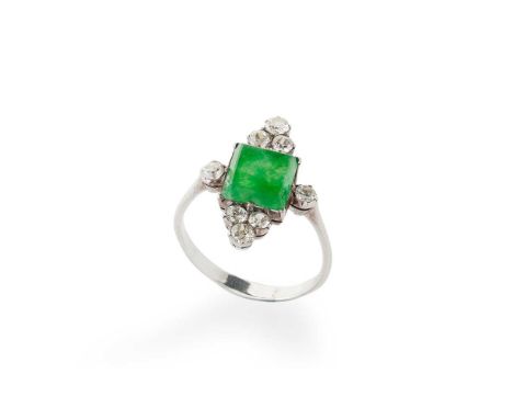 claw-set with a rectangular jade panel, in a surround of eight old round-cut diamonds, to a plain band, unmarkedRing size: Q/