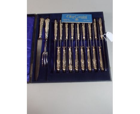 A Cased Set of Seventeen Silver Handled Knives and Silver Handled Carving Knife and Fork.