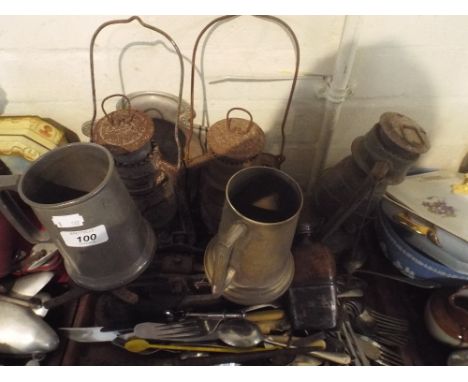 A Tray of Sundries to Include Three Hurricane Lamps, Kitchen Scales, Cutlery, Hip Flask Etc. 
