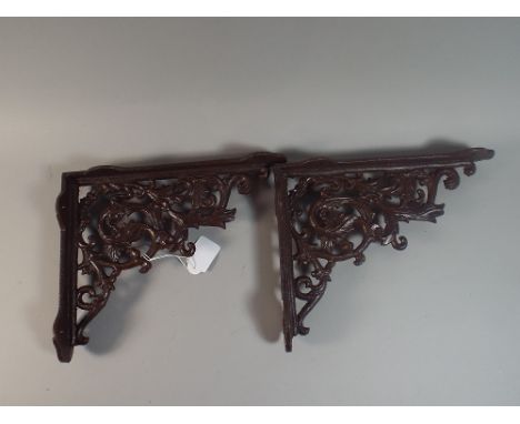 A Pair of Cast Metal Shelf Brackets Each 22 Cm High (Plus VAT).