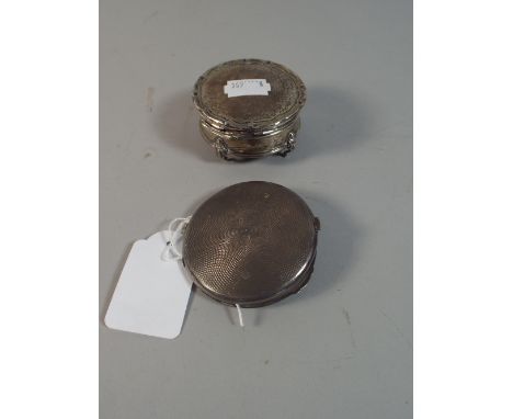 A Circular Silver Lidded Pot and A Circular Silver Powder Compact with Engine Turned Decoration.