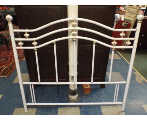 A Ceramic and Brass Double Bed End