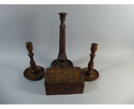 A Carved Wooden Box, Pair of Turned Oak Candle Sticks and a Single Large Oak Candle Stick