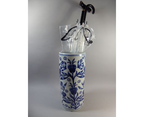 A Blue and White Ceramic Stick Stand Containing Adjustable Walking Stick and Umbrella, 45cm high