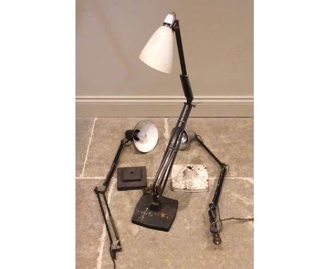 Three angle poise machinists lamps, mid 20th century, each with articulated arm upon a shaped cast base (3) (at fault) Some c