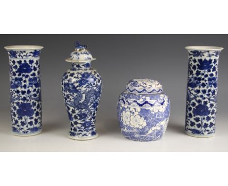 A pair of Chinese porcelain blue and white rouleau vases, 19th century, each of cylindrical form and decorated with two scrol