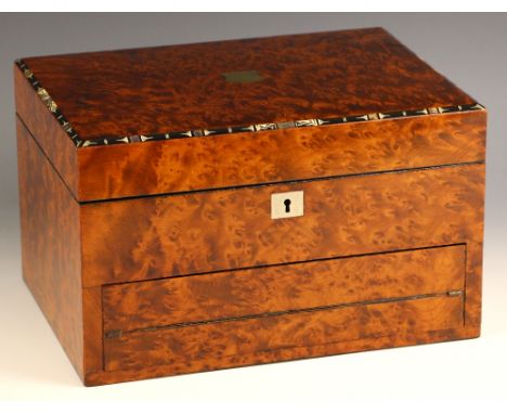 A 19th century burr yew jewellery/writing box, the hinged cover centred with a shield shaped cartouche and outlined with ebon