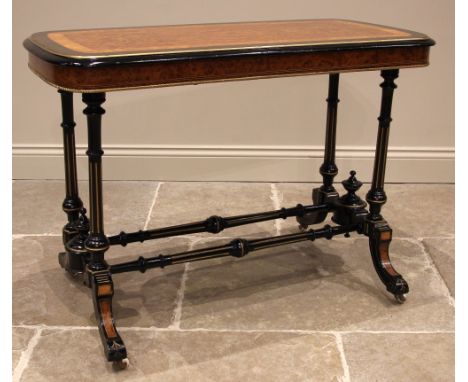 A Victorian ebonised satinwood and amboyna occasional table, the rounded rectangular top with a central book veneered amboyna
