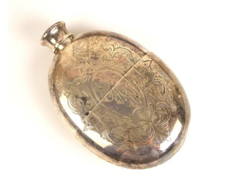 A white metal hip flask, the oval flask with all over floral geometric decoration, with pull-off stirrup cup and conforming d