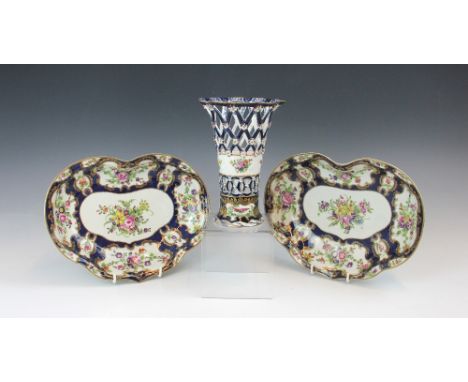 Two Worcester bon bon dishes, 18th century, decorated with floral reserves surrounded by gilt highlights to a cobalt ground, 